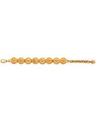 Versace - Bracciale a catena dorata con ciondoli testa di medusa - Lyst
