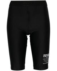 Versace - Shorts negros con leggings fuseaux - Lyst