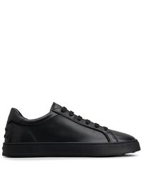 Tod's - Schoenen ,Zwart ,Zwarte Leren Sneakers Veters Ronde Neus - Lyst