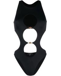 Versace - Costume intero nero in lycra riciclata con cut-out e catene medusa in metallo dorato - Lyst