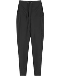 KHAITE - Tapered Trousers - Lyst
