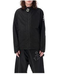 JW Anderson - Cappotto sportivo nero con zip e stampa logo - Lyst