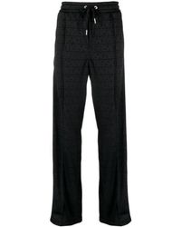 Versace - Schwarze signature allover muster hose - Lyst