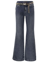 Michael Kors - Ausgestellte denim-jeans mit ketten-gürtel - Lyst