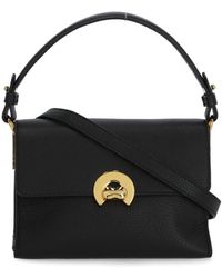 Coccinelle - Schwarze handtasche aus genarbtem leder mit griff und schulterriemen - Lyst