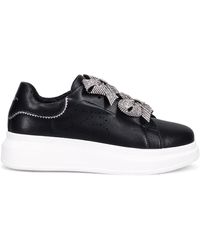Tosca Blu - Sneakers slip-on in pelle nera con fiocchi di strass scintillanti - Lyst
