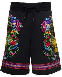 Versace - Shorts con stampa floreale e logo - Lyst