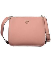 Guess - Borsa a tracolla in polietilene rosa - Lyst