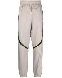 Givenchy - Broeken ,Grijs ,Leer Grijze Joggingbroek Met Logo-Detail - Lyst