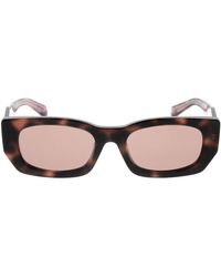 Prada - Accessoires ,Bruin ,Stijlvolle Zonnebril Voor Modieuze Individuen - Lyst