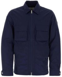 Woolrich - Elegante giacca in nylon blu per uomo - Lyst