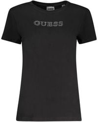 Guess - Tops ,Zwart ,Katoen Zwarte Katoenen T-Shirt Met Korte Mouwen En Strass Details - Lyst