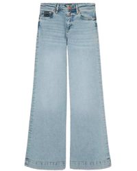 Versace - Jeans a gamba larga - blu - Lyst