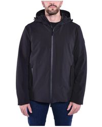 Woolrich - Jassen ,Zwart ,Polyester Tech Softshell Waterdichte Jas Met Eendendons - Lyst