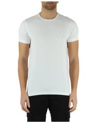 Calvin Klein - T-shirt slim fit in cotone stretch con patch logo frontale - Lyst