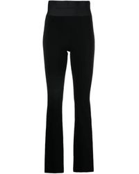 Alexander Wang - Pantaloni bootcut neri con fascia elastica logo - Lyst
