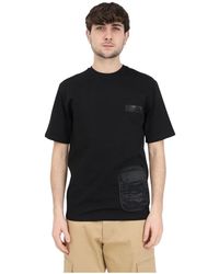 Moschino - Schwarzes baumwoll-t-shirt mit multipocket-details - Lyst