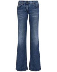 Off-White c/o Virgil Abloh - Blaue jeans mit ausgestelltem bein und logo-knopf - Lyst