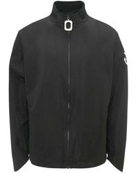 JW Anderson - Cappotto sportivo nero con zip e stampa logo - Lyst
