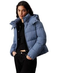 Calvin Klein - Jassen ,Blauw ,Polyester Blauwe Tijdloze Jas Met Afneembare Capuchon - Lyst