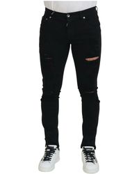Dolce & Gabbana - Jeans in denim di cotone nero slim fit strappati - Lyst