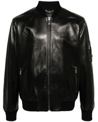 Versace - Schwarze jacke mit besticktem logo - Lyst