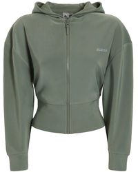 Ropa deportiva, de gimnasio y entrenamiento Guess de mujer: hasta el 60 %  de descuento | Lyst
