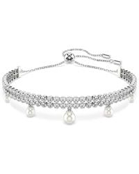 Swarovski - Pulsera ariana grande x , perla de cristal, talla redonda, blanca, baño de rodio - Lyst