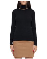Moschino - Elegante maglione nero in lana con collo alto - Lyst