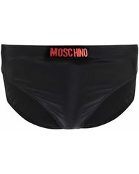 Moschino - Badebekleidung, schwarze/rote logo-buchstabierung badehose mit stretch-design und elastischem bund - Lyst