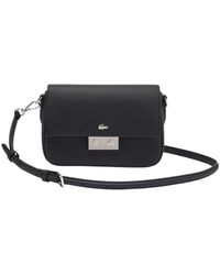 Lacoste - Daily city klappentasche in schwarz - Lyst