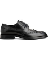 Tod's - Klassische derby-schuhe aus schwarzem leder - Lyst