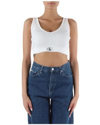 Calvin Klein - Top in cotone stretch con scollo a v a costine - Lyst