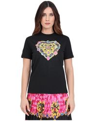Versace - T-shirt nera con stampa heart couture - Lyst