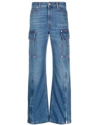 Stella McCartney - 70er jahre dunkelblaue reißverschluss cargo jeans,blaue denim jeans mit appliqué logo und weitem bein - Lyst