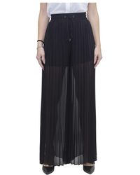 Pantalones de pernera ancha y palazzo Guess de mujer: hasta el 35 % de  descuento | Lyst
