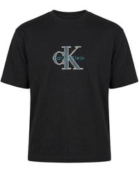 Calvin Klein - Tops ,Zwart ,Katoen T-Shirt Met Korte Mouwen En Ronde Hals Met Print - Lyst