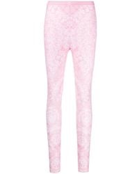 Versace - Pantaloni super-skinny rosa con motivo barocco - Lyst