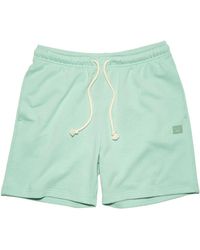 Acne Studios - Pantaloncini in cotone verde pallido con patch logo - Lyst