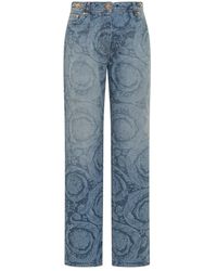 Versace - Jeans con estampado láser barroco y detalles medusa - Lyst