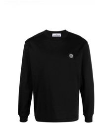 Stone Island - Schwarzes langarm-t-shirt mit ikonischem patch-logo - Lyst