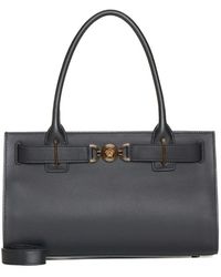 Versace - Schwarze tote tasche mit medusa-plakette,stilvolle taschen für modebegeisterte - Lyst