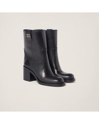 Miu Miu - Logo Leather Ankle Boots - Lyst
