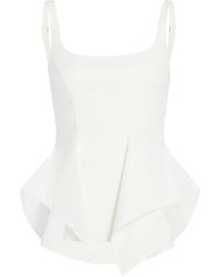 KHAITE - Loa Cotton Peplum Top - Lyst