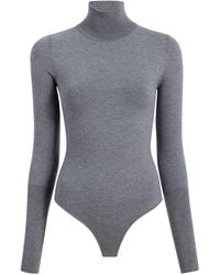 KHAITE - Thea Knit Wool-blend Turtleneck Bodysuit - Lyst