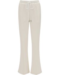 JW Anderson - Flared Crepe Pants - Lyst
