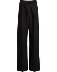 Victoria Beckham - Moda Exclusive Curved-Leg Virgin Wool-Blend Trousers - Lyst