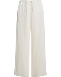 TOTEME - Woven Stripe Drawstring Trousers - Lyst
