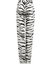 Alaïa - Zebra-print Straight-leg Jeans - Lyst