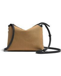 KHAITE - Lina Medium Leather-Trimmed Canvas Crossbody Bag - Lyst